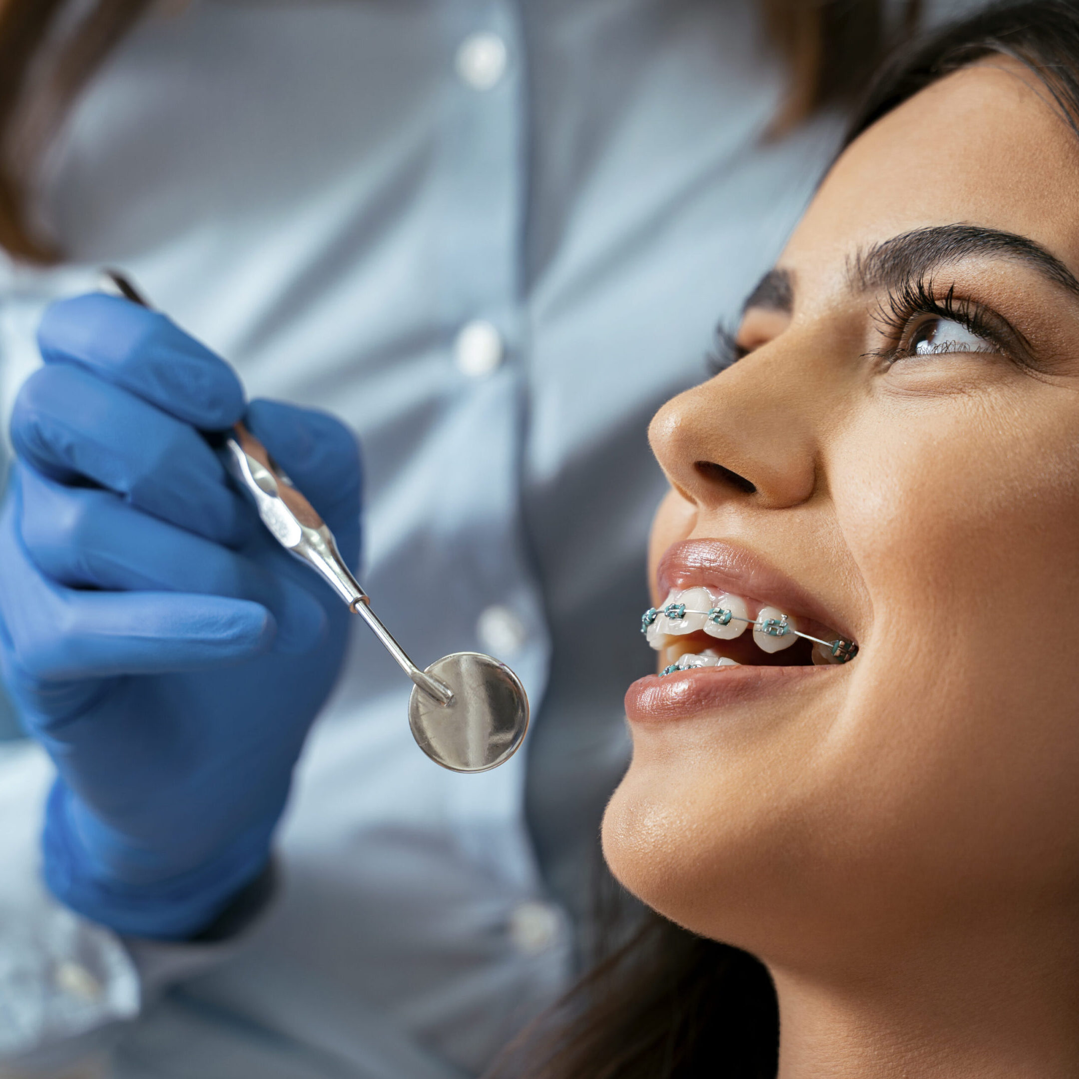 Young woman with braces at dental checkup